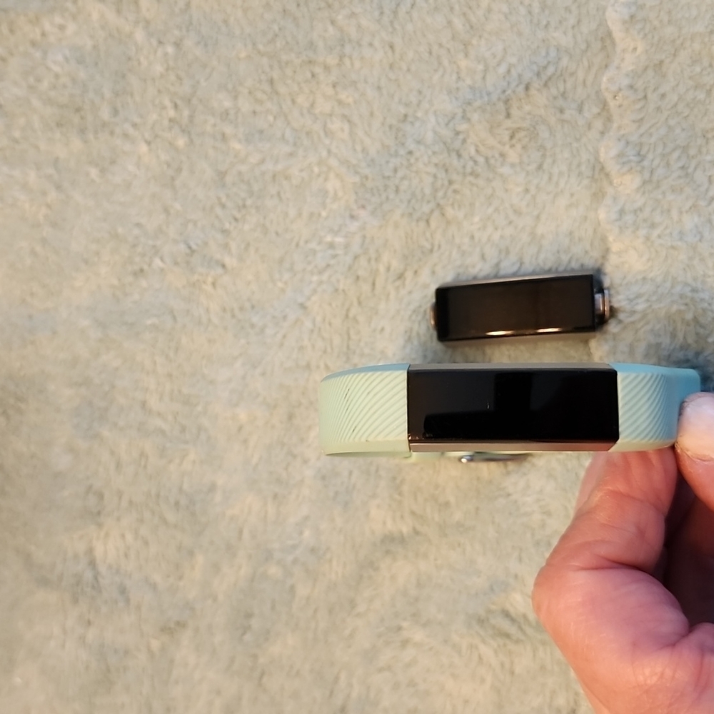 Fitbit Original fitness tracker TWO included with 1 band and a charger.